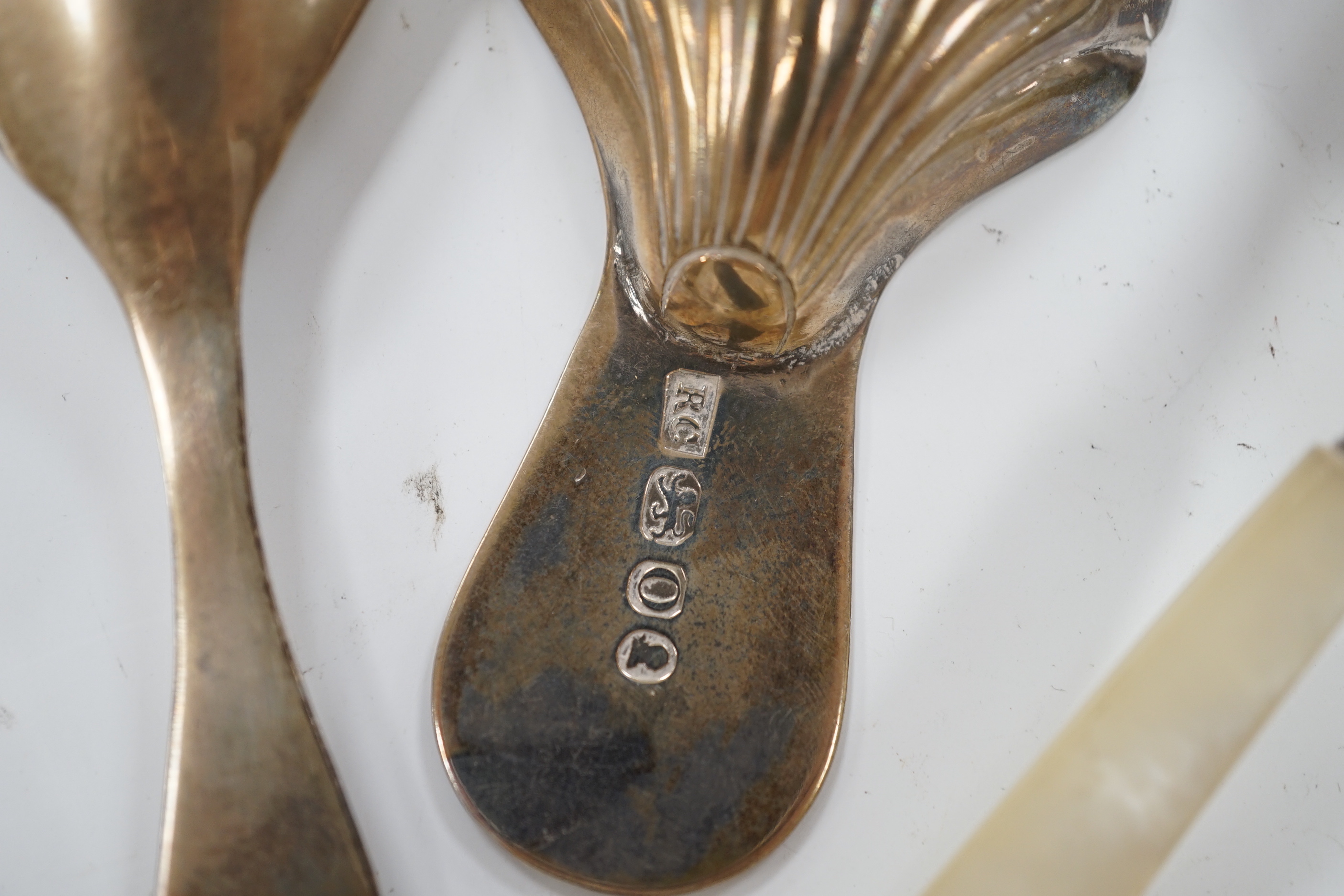 Two 19th century silver caddy spoons including mother of pearl handled by George Unite, 12.1cm and two later silver caddy spoons.